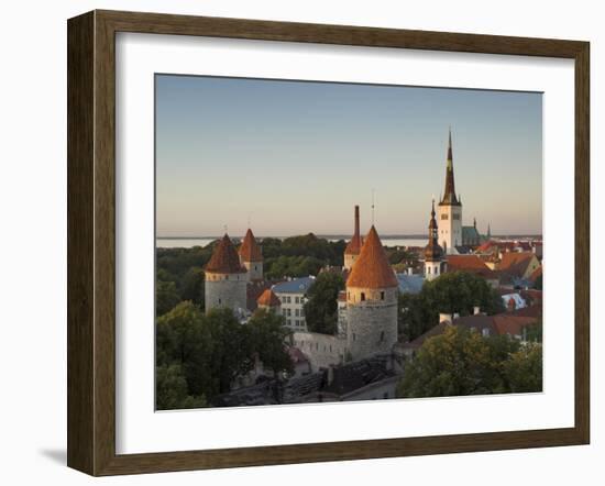 Medieval Town Walls and Spire of St. Olavs Church at Dusk, Tallinn, Estonia, Baltic States, Europe-Neale Clarke-Framed Photographic Print