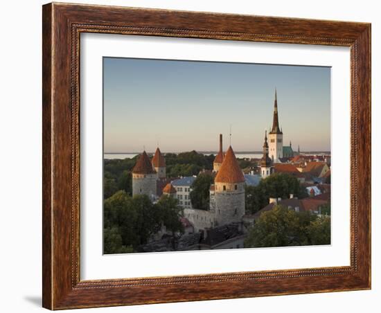 Medieval Town Walls and Spire of St. Olavs Church at Dusk, Tallinn, Estonia, Baltic States, Europe-Neale Clarke-Framed Photographic Print