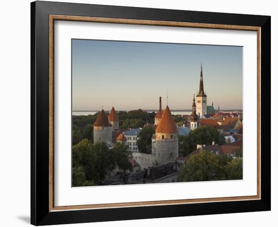 Medieval Town Walls and Spire of St. Olavs Church at Dusk, Tallinn, Estonia, Baltic States, Europe-Neale Clarke-Framed Photographic Print