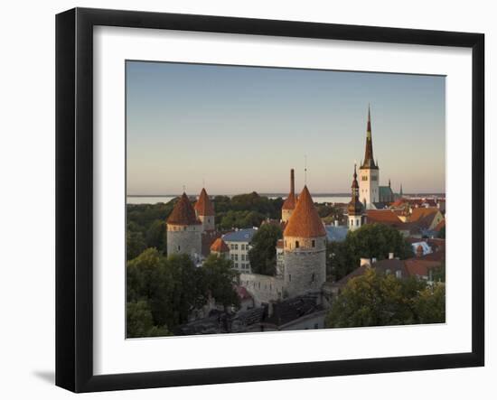 Medieval Town Walls and Spire of St. Olavs Church at Dusk, Tallinn, Estonia, Baltic States, Europe-Neale Clarke-Framed Photographic Print