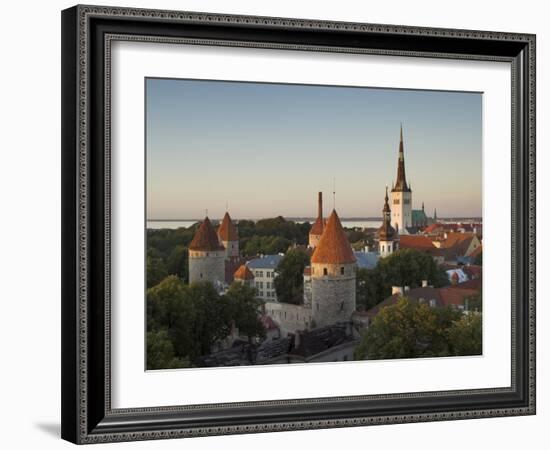 Medieval Town Walls and Spire of St. Olavs Church at Dusk, Tallinn, Estonia, Baltic States, Europe-Neale Clarke-Framed Photographic Print