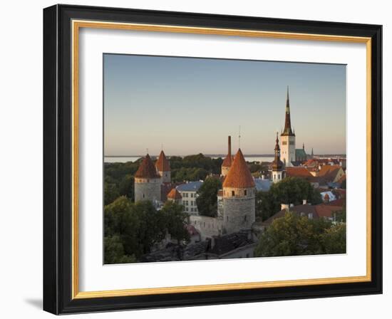 Medieval Town Walls and Spire of St. Olavs Church at Dusk, Tallinn, Estonia, Baltic States, Europe-Neale Clarke-Framed Photographic Print