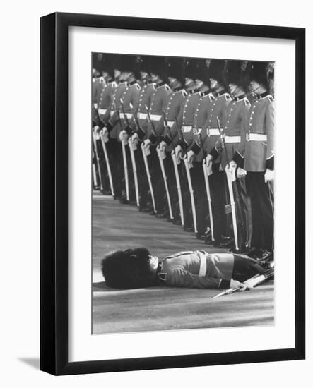 Member of Honor Guard Lying on the Ground After Fainting During Ceremonies For Queen Elizabeth-John Loengard-Framed Photographic Print