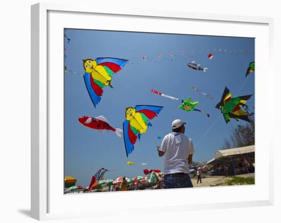 Member of Indonesia Kite Team Flies Kite with Series of Colorful Bird Sales, Vung Tau City, Vietnam-null-Framed Photographic Print