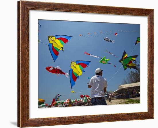 Member of Indonesia Kite Team Flies Kite with Series of Colorful Bird Sales, Vung Tau City, Vietnam-null-Framed Photographic Print