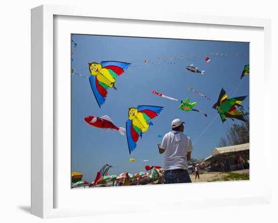 Member of Indonesia Kite Team Flies Kite with Series of Colorful Bird Sales, Vung Tau City, Vietnam-null-Framed Photographic Print