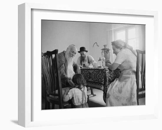 Members of a Jewish Family Sitting Down For a Meal-Paul Schutzer-Framed Photographic Print