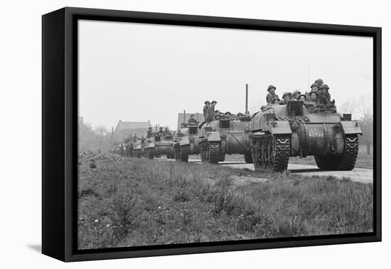 Members of the British 49th Armoured Personnel Carrier Regiment Riding Along a Line of Tanks-George Silk-Framed Premier Image Canvas