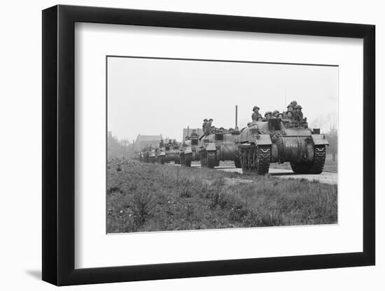 Members of the British 49th Armoured Personnel Carrier Regiment Riding Along a Line of Tanks-George Silk-Framed Photographic Print