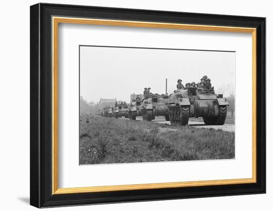 Members of the British 49th Armoured Personnel Carrier Regiment Riding Along a Line of Tanks-George Silk-Framed Photographic Print