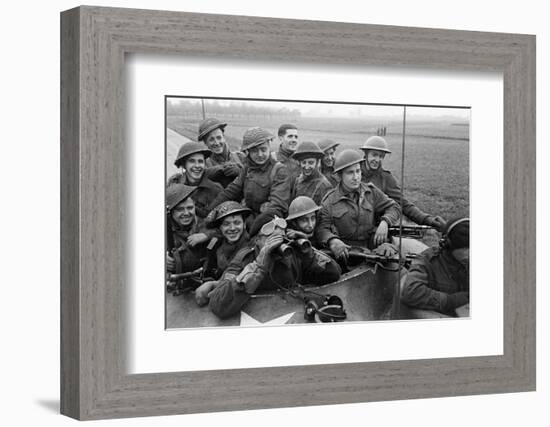 Members of the British 49th Armoured Personnel Carrier Regiment Riding Along a Line of Tanks-George Silk-Framed Photographic Print