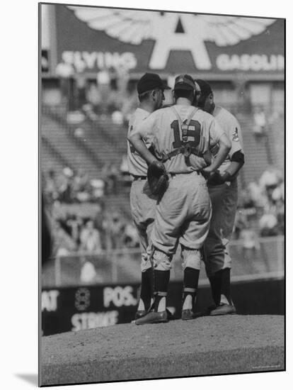 Members of the Cleveland Indians Conferring on the Mound During a Game-Yale Joel-Mounted Premium Photographic Print