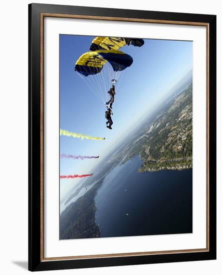 Members of US Navy Parachute Team, the Leap Frogs, Perform Bi-Plane with Parachutes Above Seattle-null-Framed Photographic Print