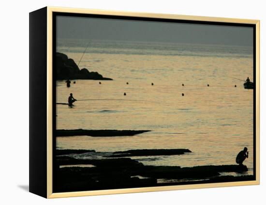 Men are Silhouetted Against the Sea as They Fish and Relax on the Beirut Coastline, August 24, 2006-Matt Dunham-Framed Premier Image Canvas