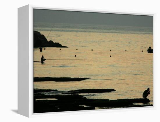 Men are Silhouetted Against the Sea as They Fish and Relax on the Beirut Coastline, August 24, 2006-Matt Dunham-Framed Premier Image Canvas