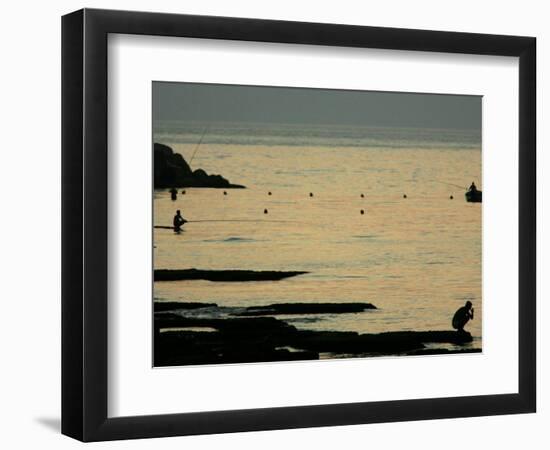 Men are Silhouetted Against the Sea as They Fish and Relax on the Beirut Coastline, August 24, 2006-Matt Dunham-Framed Photographic Print