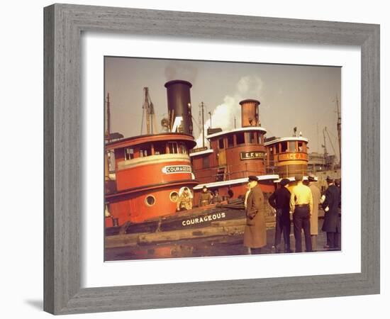 Men at pier looking at 3 Tugboats, One Named "Courageous" with Crewmen on Deck-Andreas Feininger-Framed Photographic Print