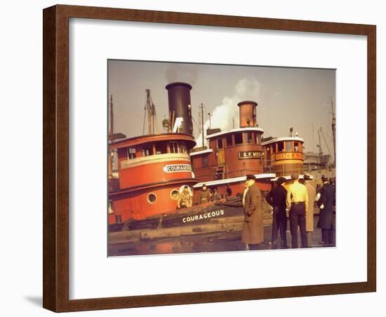 Men at pier looking at 3 Tugboats, One Named "Courageous" with Crewmen on Deck-Andreas Feininger-Framed Photographic Print