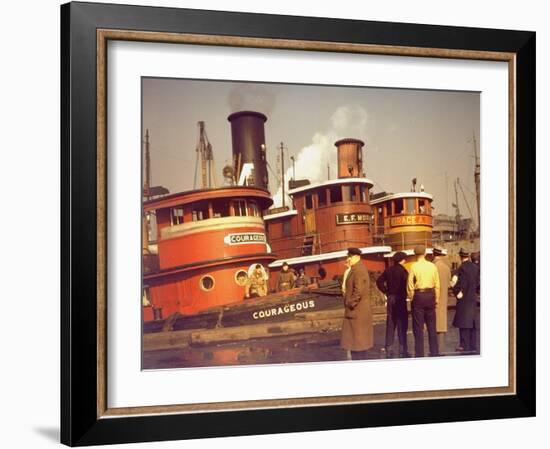 Men at pier looking at 3 Tugboats, One Named "Courageous" with Crewmen on Deck-Andreas Feininger-Framed Photographic Print