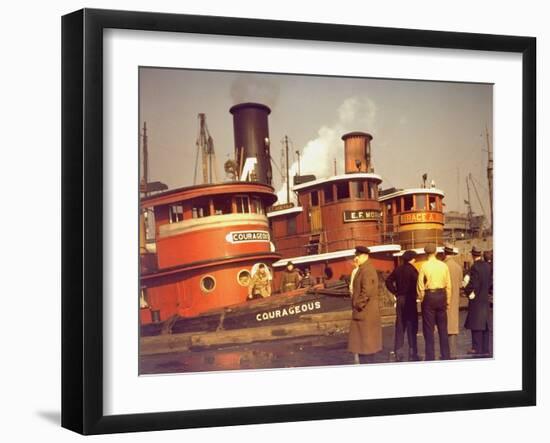 Men at pier looking at 3 Tugboats, One Named "Courageous" with Crewmen on Deck-Andreas Feininger-Framed Photographic Print