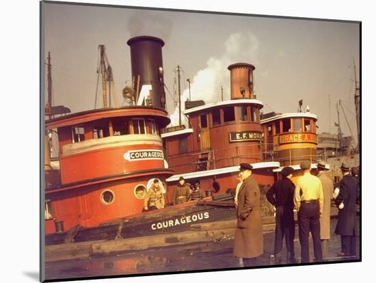 Men at pier looking at 3 Tugboats, One Named "Courageous" with Crewmen on Deck-Andreas Feininger-Mounted Photographic Print