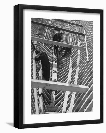 Men Building Ship Out of Wood-Dmitri Kessel-Framed Photographic Print