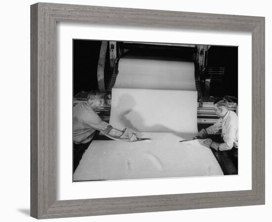 Men Cutting Sheet of Newly Manufactured Rubber-null-Framed Photographic Print
