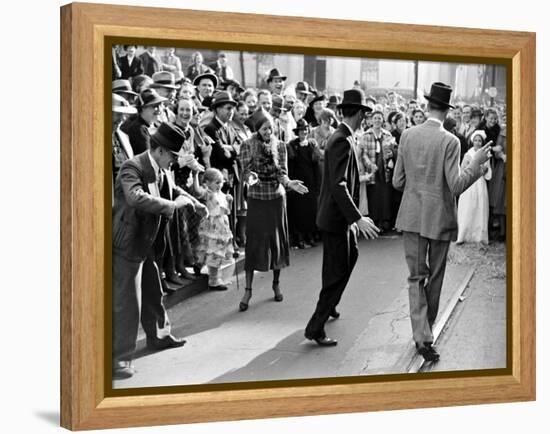 Men dancing in the street as revelers celebrate New Orleans Mardi Gras. February 1938-William Vandivert-Framed Premier Image Canvas