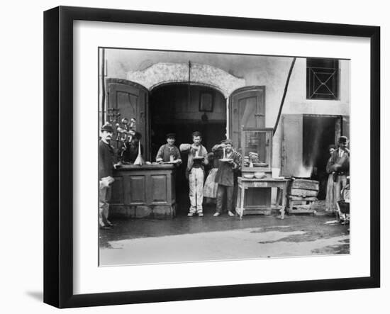 Men Eating Long Spaghetti at a Street Food Shop in Naples, Italy, Ca. 1900-null-Framed Photo