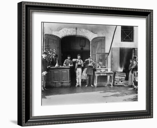 Men Eating Long Spaghetti at a Street Food Shop in Naples, Italy, Ca. 1900-null-Framed Photo