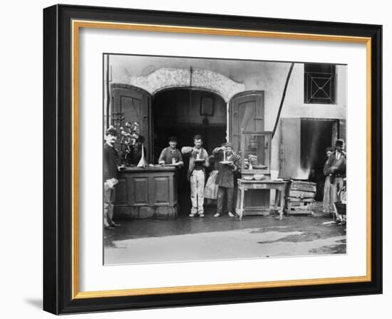 Men Eating Long Spaghetti at a Street Food Shop in Naples, Italy, Ca. 1900-null-Framed Photo