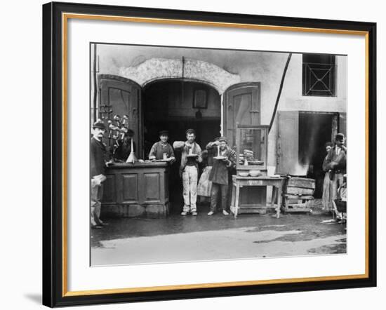 Men Eating Long Spaghetti at a Street Food Shop in Naples, Italy, Ca. 1900-null-Framed Photo