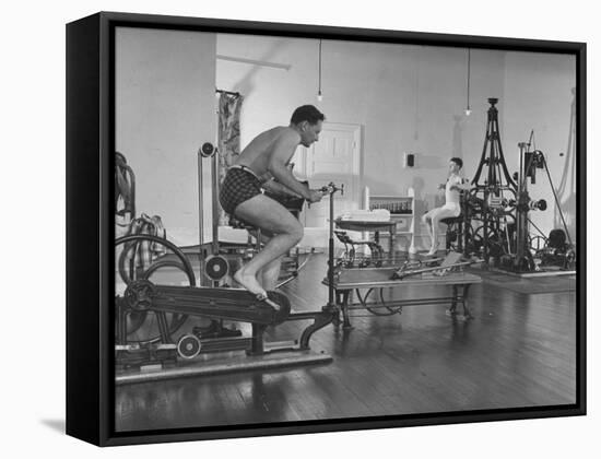 Men Exercising in Gymnasium at Homestead Hotel-John Phillips-Framed Premier Image Canvas