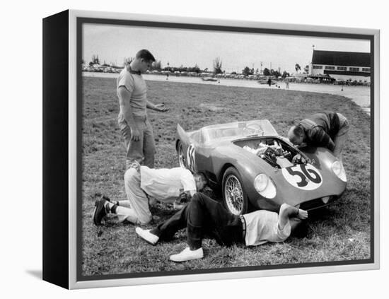 Men Fixing Their Race Car During the Grand Prix-Stan Wayman-Framed Premier Image Canvas