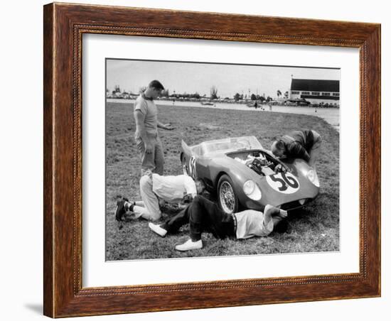 Men Fixing Their Race Car During the Grand Prix-Stan Wayman-Framed Photographic Print