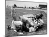 Men Fixing Their Race Car During the Grand Prix-Stan Wayman-Mounted Photographic Print