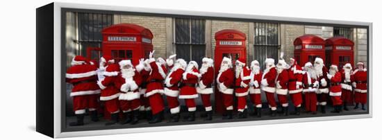 Men from the London Santa School, Dressed in Christmas Outfits, Pose by Telephone Boxes in London-null-Framed Premier Image Canvas