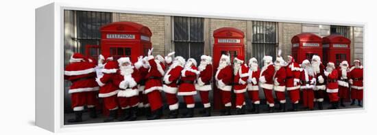 Men from the London Santa School, Dressed in Christmas Outfits, Pose by Telephone Boxes in London-null-Framed Premier Image Canvas