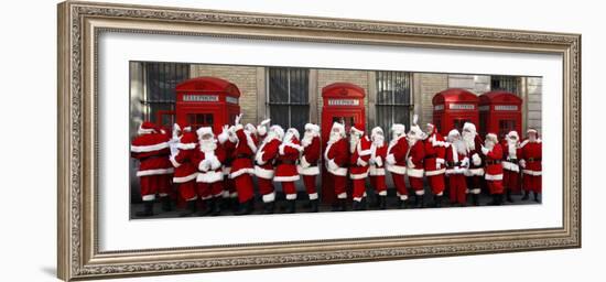 Men from the London Santa School, Dressed in Christmas Outfits, Pose by Telephone Boxes in London-null-Framed Photographic Print