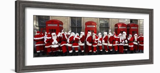 Men from the London Santa School, Dressed in Christmas Outfits, Pose by Telephone Boxes in London-null-Framed Photographic Print