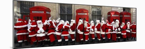 Men from the London Santa School, Dressed in Christmas Outfits, Pose by Telephone Boxes in London-null-Mounted Photographic Print