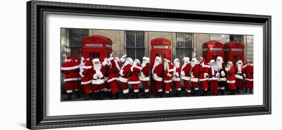 Men from the London Santa School, Dressed in Christmas Outfits, Pose by Telephone Boxes in London-null-Framed Photographic Print