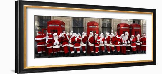 Men from the London Santa School, Dressed in Christmas Outfits, Pose by Telephone Boxes in London-null-Framed Photographic Print