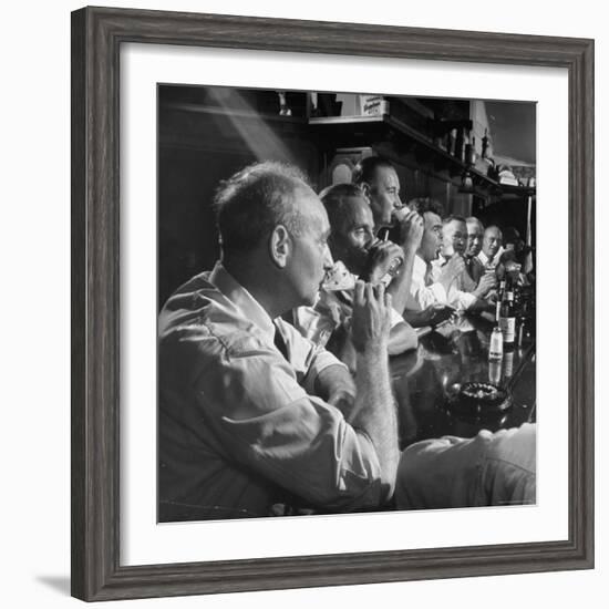 Men Gathered Around For Their Weekly Meeting Indulging in Glasses of Beer-Frank Scherschel-Framed Photographic Print