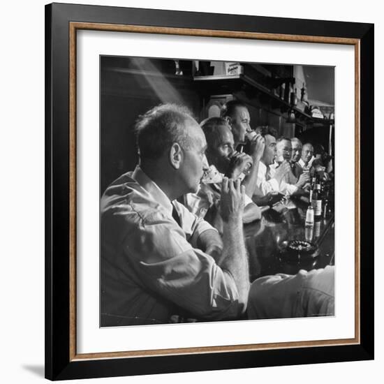 Men Gathered Around For Their Weekly Meeting Indulging in Glasses of Beer-Frank Scherschel-Framed Photographic Print