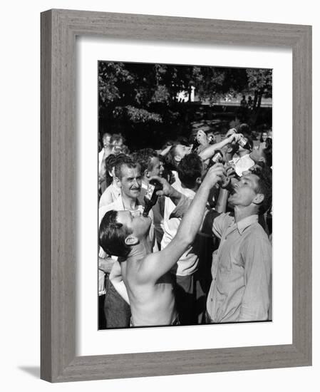 Men Having a Beer Drinking Contest at the Company Picnic-Allan Grant-Framed Photographic Print