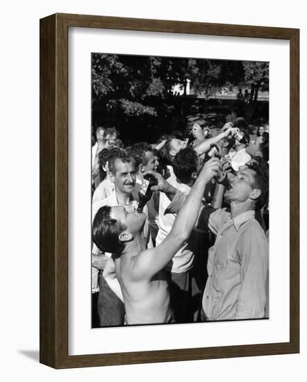 Men Having a Beer Drinking Contest at the Company Picnic-Allan Grant-Framed Photographic Print