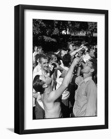 Men Having a Beer Drinking Contest at the Company Picnic-Allan Grant-Framed Photographic Print