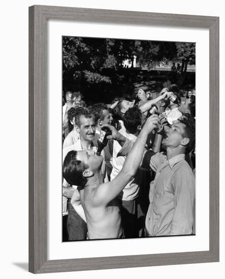 Men Having a Beer Drinking Contest at the Company Picnic-Allan Grant-Framed Photographic Print