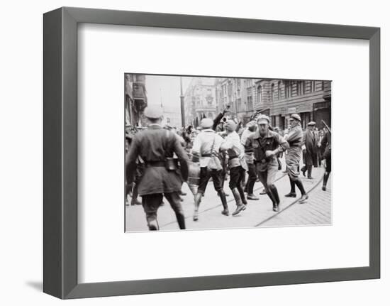 Men in Bolshevik uniform fighting police in the street, Germany, c1918-c1933(?) (1936)-Unknown-Framed Photographic Print